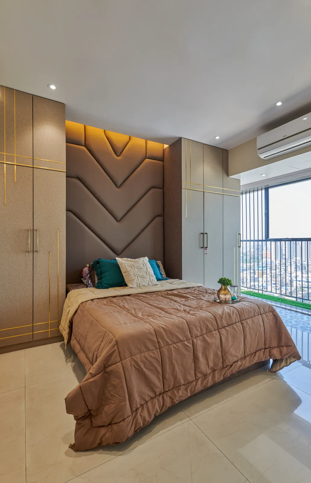 The interplay of textures and natural light creates a calming ambiance in Bedroom 2, with the balcony offering a refreshing view.