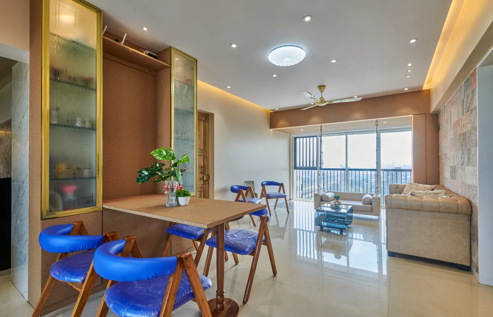 The open-plan layout seamlessly integrates the dining, living, and balcony areas, creating a sense of spaciousness and fluidity.