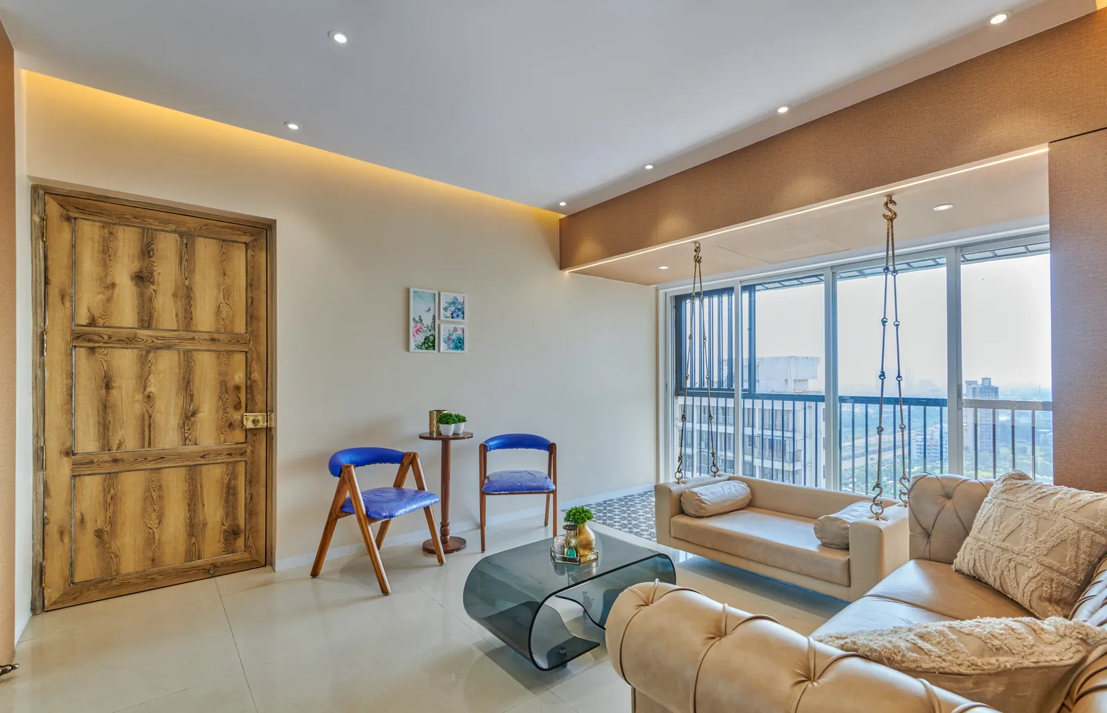 The open-plan layout seamlessly connects the living room to the entrance and balcony, creating a spacious and airy feel